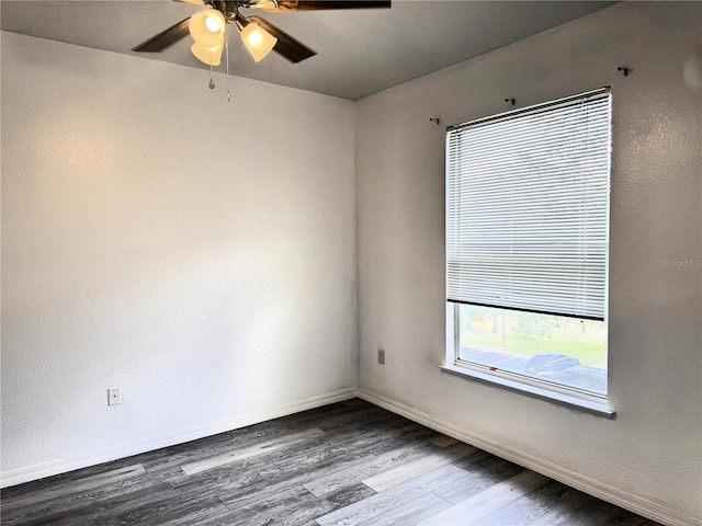 spare room featuring hardwood / wood-style flooring and ceiling fan