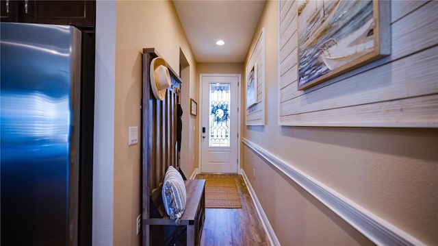 entryway with hardwood / wood-style floors