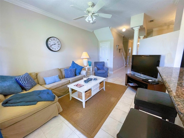 tiled living room featuring decorative columns, ceiling fan, a textured ceiling, and ornamental molding