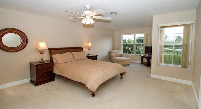 bedroom featuring ceiling fan and light colored carpet