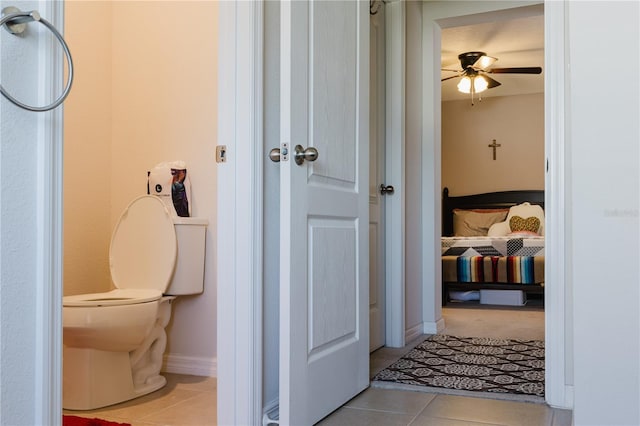 bathroom featuring toilet, tile patterned floors, and ceiling fan