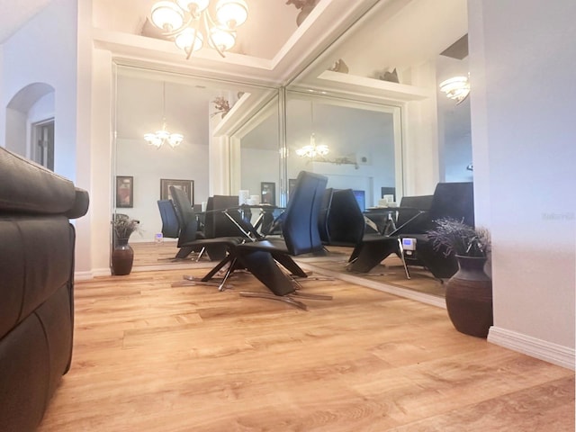 dining area featuring a notable chandelier and wood-type flooring