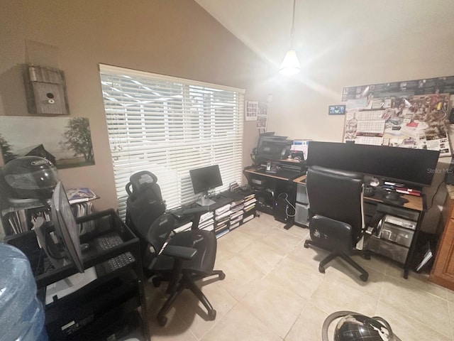 office space featuring lofted ceiling and light tile patterned floors