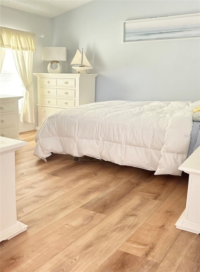 bedroom featuring light hardwood / wood-style flooring