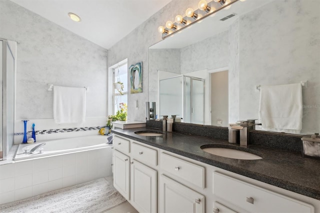 bathroom with vanity and separate shower and tub