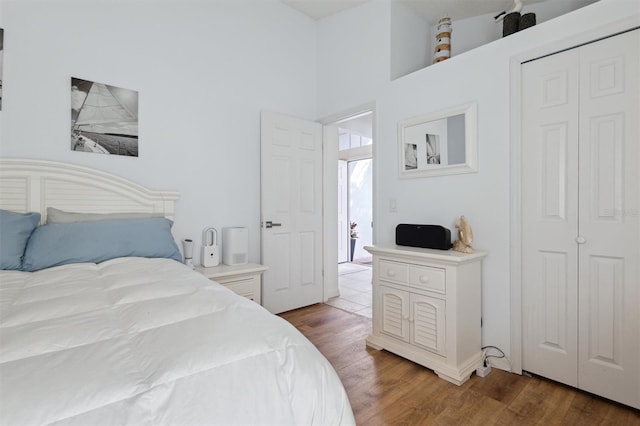 bedroom with dark hardwood / wood-style flooring