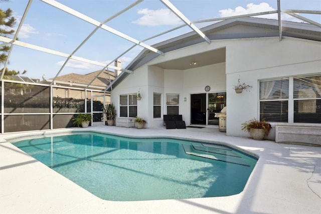 view of pool with a lanai and a patio area