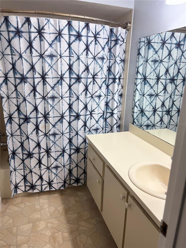 bathroom featuring shower / tub combo with curtain and vanity