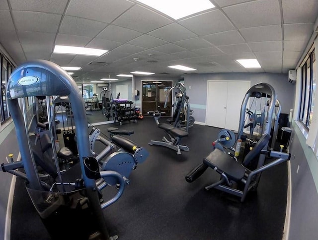 workout area featuring a paneled ceiling