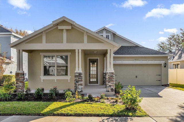 craftsman inspired home with covered porch and a garage