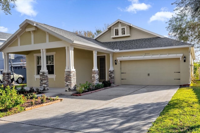 view of front of home featuring a porch and a garage