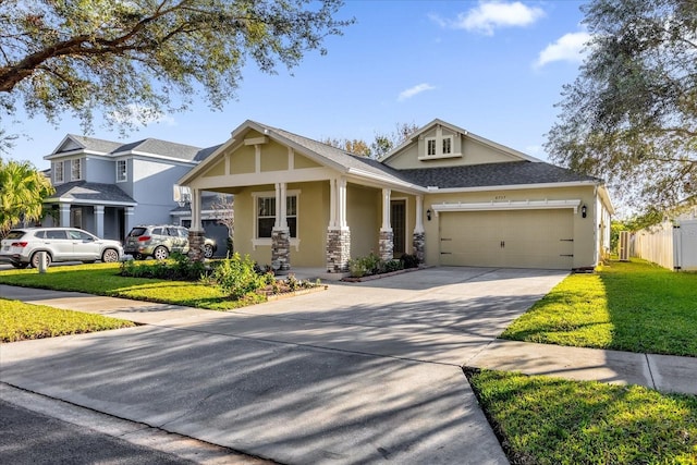 view of front of property featuring a porch, a garage, and a front lawn