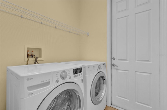 washroom featuring washing machine and dryer