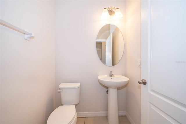 bathroom with tile patterned floors, sink, and toilet