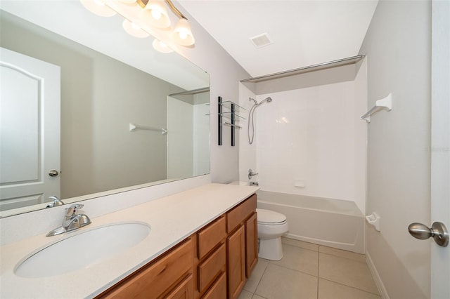 full bathroom featuring toilet, vanity, tile patterned floors, and washtub / shower combination