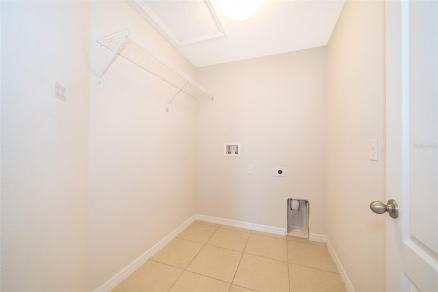 laundry area with electric dryer hookup, light tile patterned floors, and hookup for a washing machine