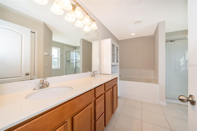 bathroom with tile patterned floors, vanity, and plus walk in shower