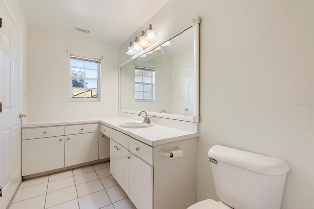 bathroom with vanity, tile patterned floors, and toilet