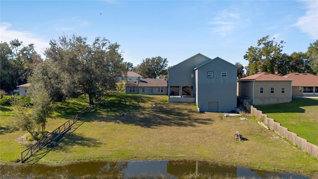 rear view of property featuring a water view