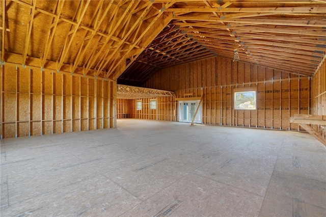 miscellaneous room with lofted ceiling