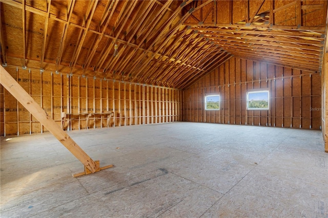 miscellaneous room with lofted ceiling