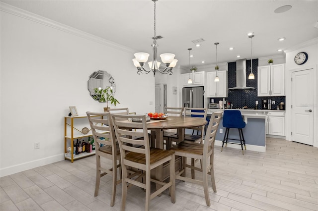 dining room with crown molding, an inviting chandelier, and light hardwood / wood-style flooring