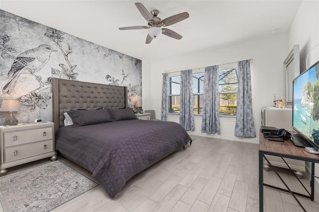 bedroom with ceiling fan and light hardwood / wood-style flooring