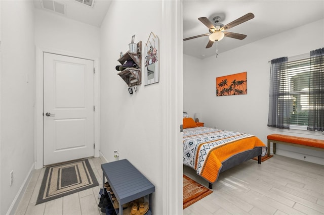 bedroom featuring light hardwood / wood-style floors and ceiling fan