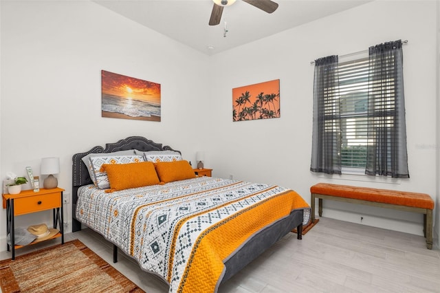 bedroom with hardwood / wood-style floors and ceiling fan