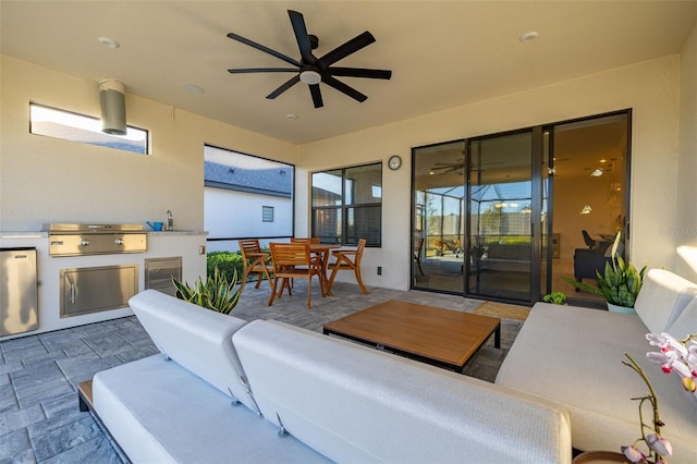 view of patio / terrace with area for grilling, sink, and ceiling fan