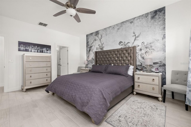 bedroom featuring light hardwood / wood-style floors and ceiling fan