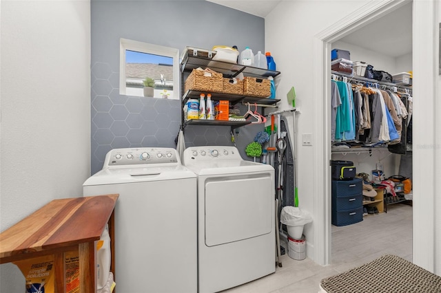 laundry room with washing machine and clothes dryer