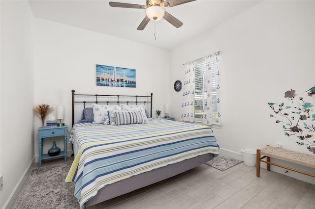 bedroom with wood-type flooring and ceiling fan