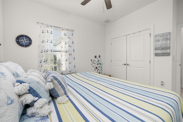 bedroom featuring ceiling fan and a closet