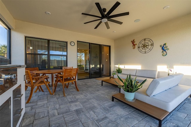 view of patio / terrace featuring ceiling fan and an outdoor living space