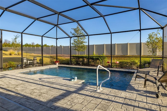 view of pool with a lanai and a patio area