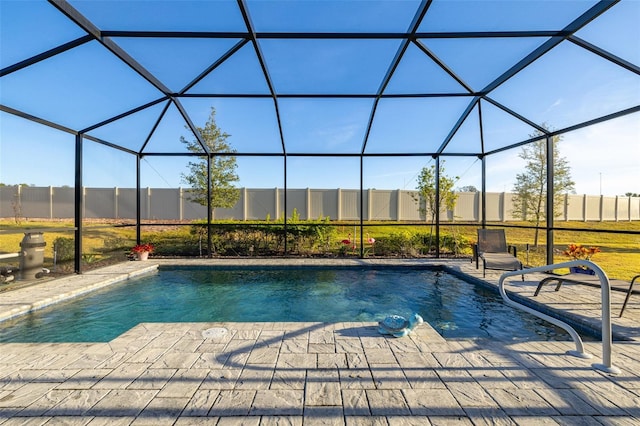 view of pool with a lanai and a patio area