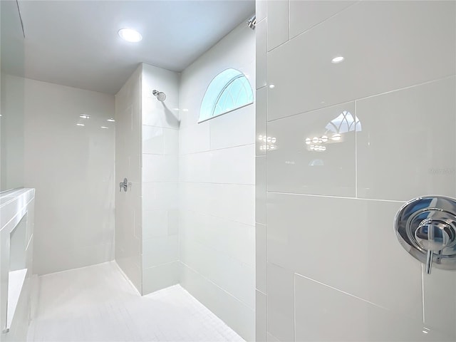 bathroom with a tile shower