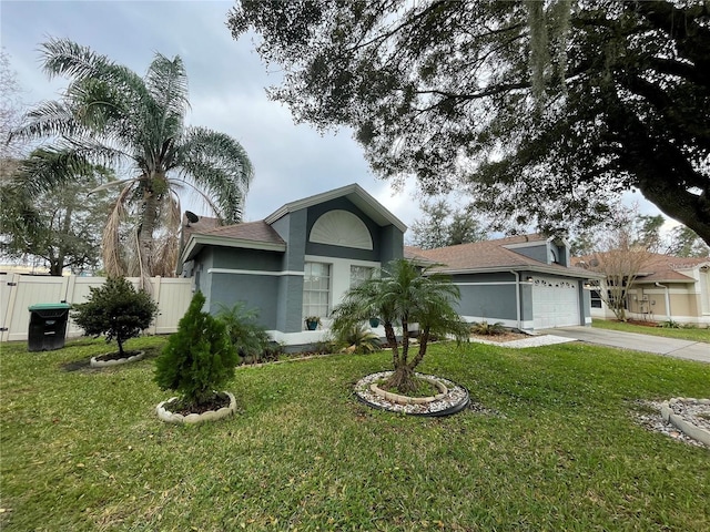 single story home with a front yard and a garage