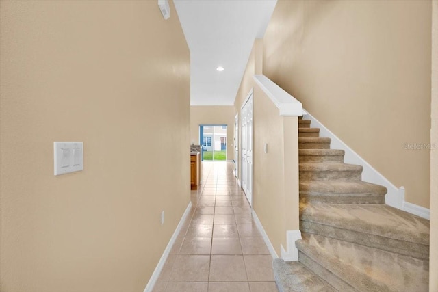 hallway featuring light tile patterned flooring