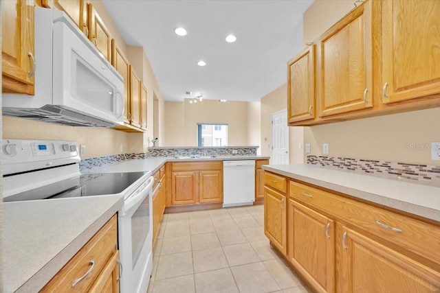 kitchen with light tile patterned flooring, white appliances, decorative backsplash, and light brown cabinets