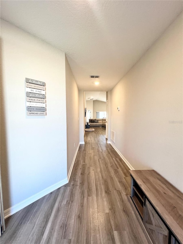 hallway featuring hardwood / wood-style floors