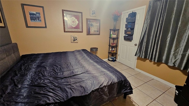 bedroom featuring light tile patterned floors