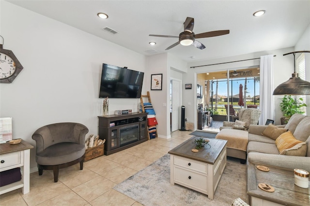 living room with ceiling fan and light tile patterned floors