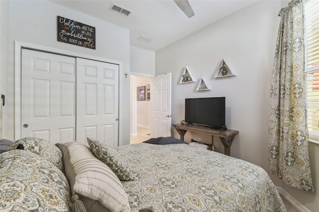 bedroom with multiple windows, a closet, and ceiling fan