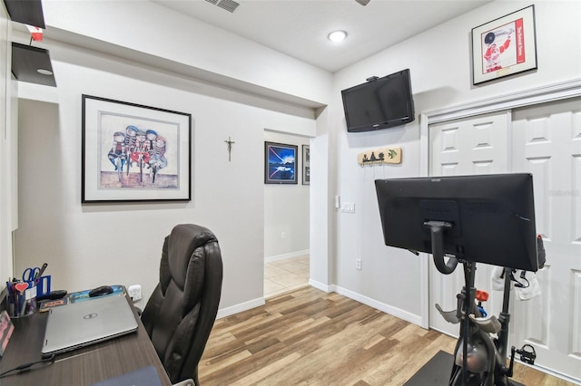 office area with light hardwood / wood-style flooring