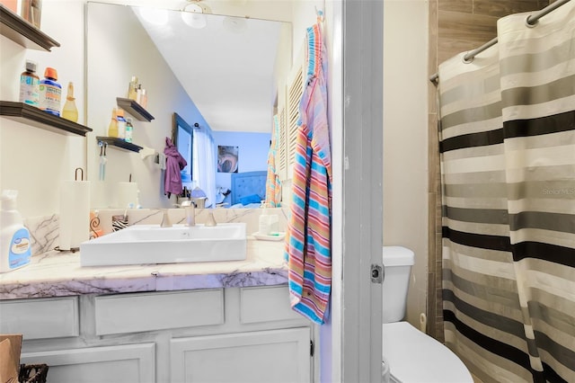 bathroom featuring sink and toilet