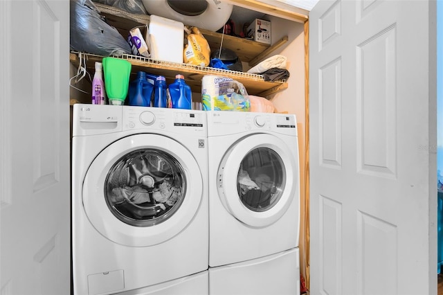 laundry room featuring washing machine and clothes dryer