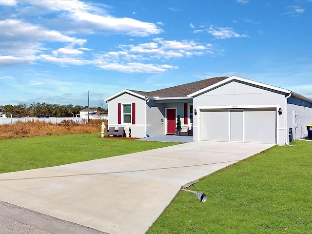 ranch-style home with a garage and a front lawn