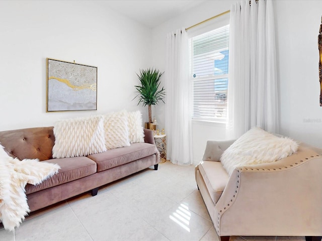 living room featuring tile patterned flooring and plenty of natural light